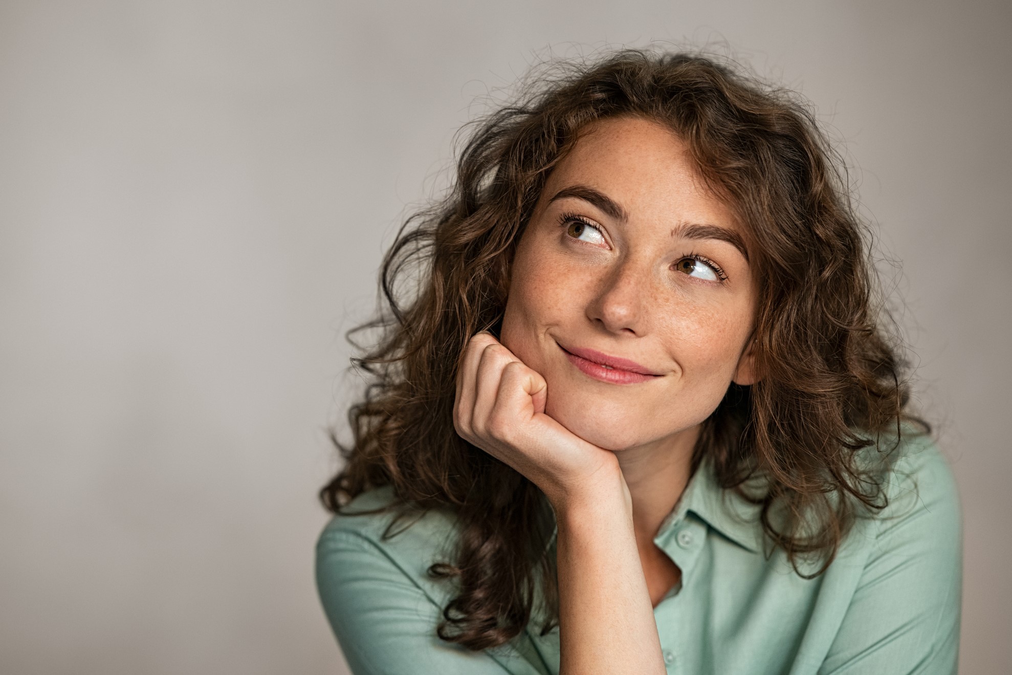 Woman smiling and thinking