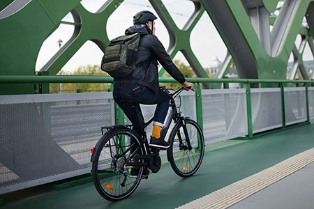 ManRidingeBikeonBridge ManRidingeBikeonBridge